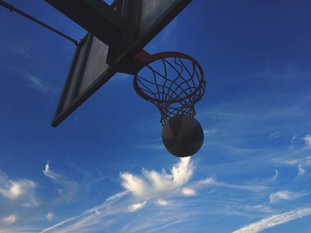 istock Playing basketball outdoors 1188609385