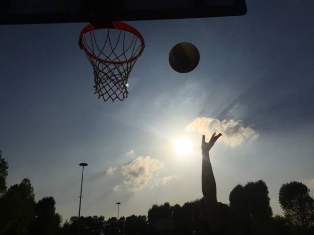 istock Playing basketball outdoors 1188609404