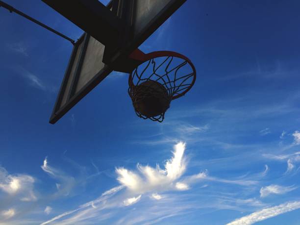 istock Playing basketball outdoors 1188609422
