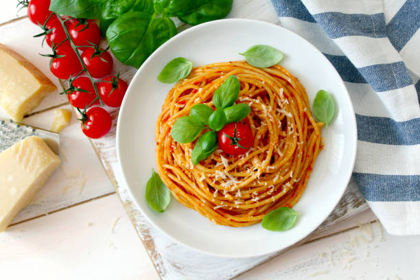 istock Spaghetti with tomato sauce on white background. 1188610228