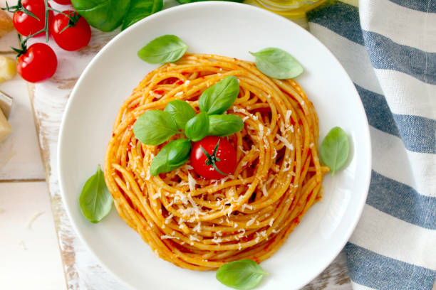 istock Spaghetti with tomato sauce on white background. 1188610255