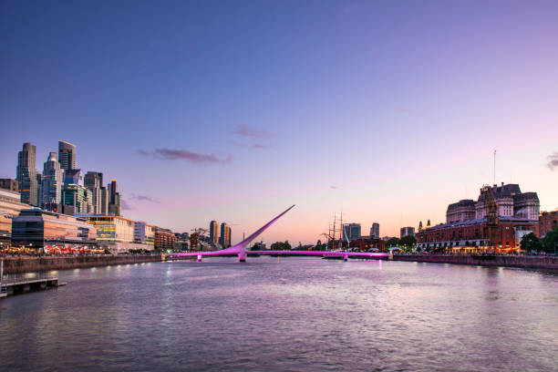 Puerto Madero in Buenos Aires at dusk Beautiful view on the canal between downtown Buenos Aires and Puerto Madero, a new district of business and residential buildings. puente de la mujer stock pictures, royalty-free photos & images