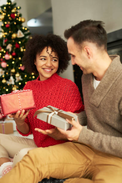 istock Happy couple sharing the Christmas presents 1188611397