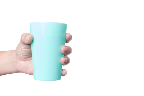 istock Hand holding plastic cup of water 1188611514