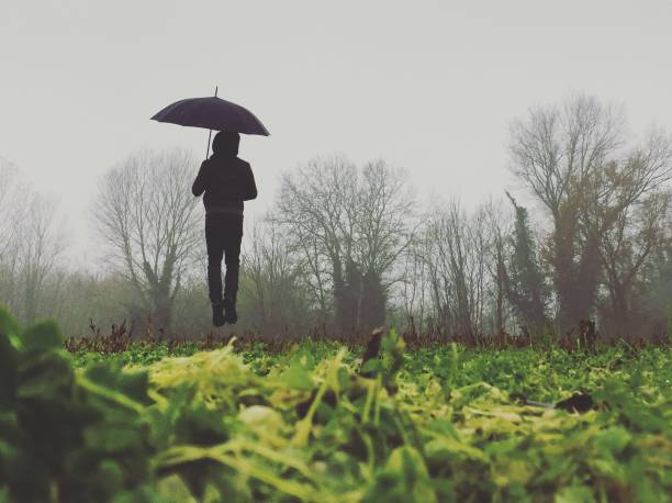 istock man in the fog with an umbrella 1188611578