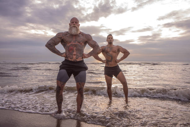 istock Tattooed Senior Man coaching young man During Workout 1188611706
