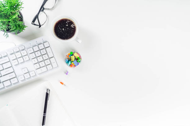 istock desk, top view, above, flatlay, mockup, notebook, keyboard, paper, white, desktop, coffee, cup, laptop, workspace, creative, note, computer, student, business, pen, pencils, school, phone, overhead, table, surface, work, todo, meeting, empty 1188611931