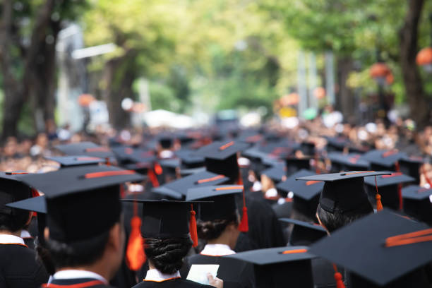 istock Group of Graduates during commencement. Concept education congratulation in University Degree. Graduation Ceremony 1188613635
