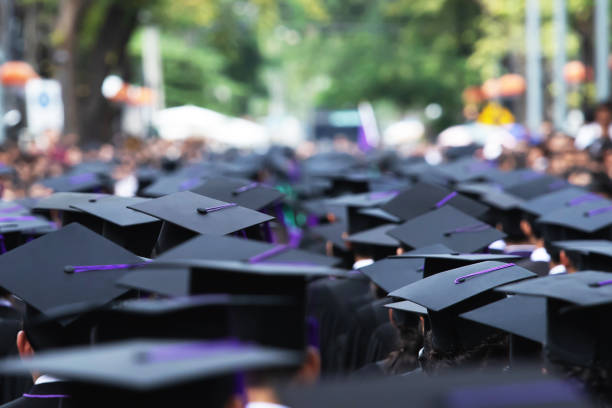 istock Group of Graduates during commencement. Concept education congratulation in University Degree. Graduation Ceremony 1188613725