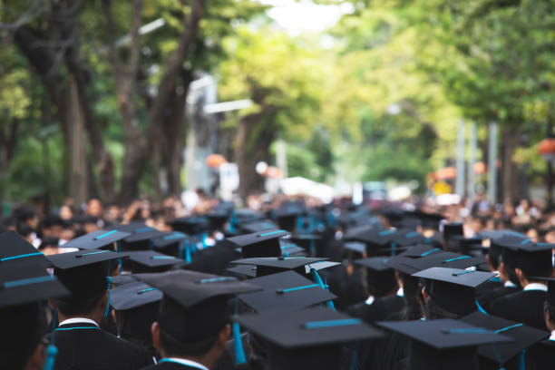 istock Group of Graduates during commencement. Concept education congratulation in University Degree. Graduation Ceremony 1188613731