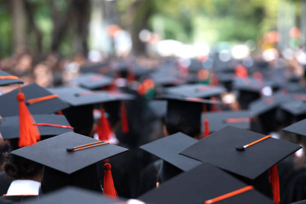 istock Group of Graduates during commencement. Concept education congratulation in University Degree. Graduation Ceremony 1188613790