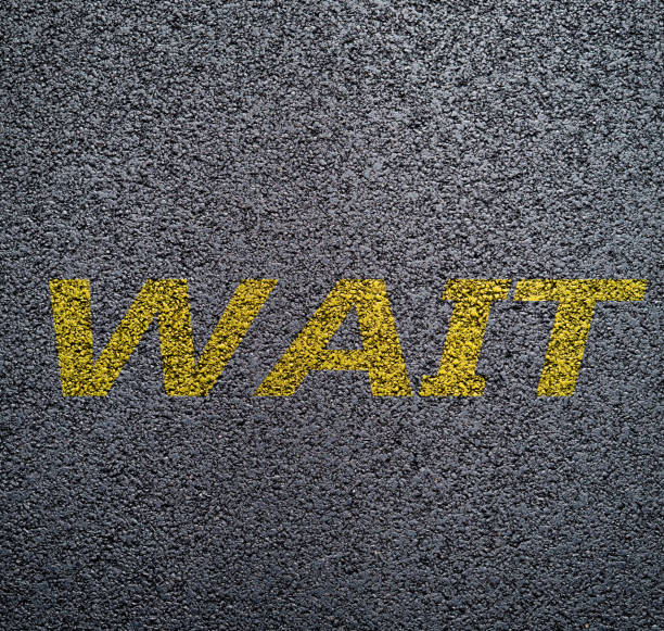 Yellow numbers and signs on the asphalt