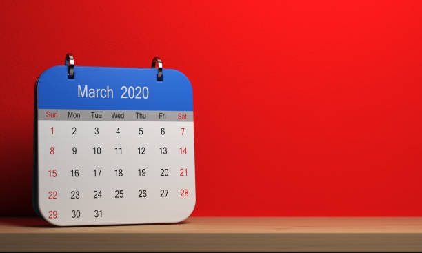 istock Small 2020 calendar with blue cap standing on wooden shelf 1188616496