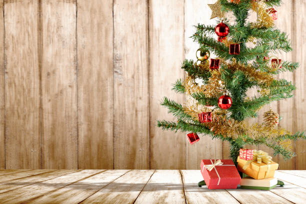 istock Christmas tree with gift box on the floor 1188616880