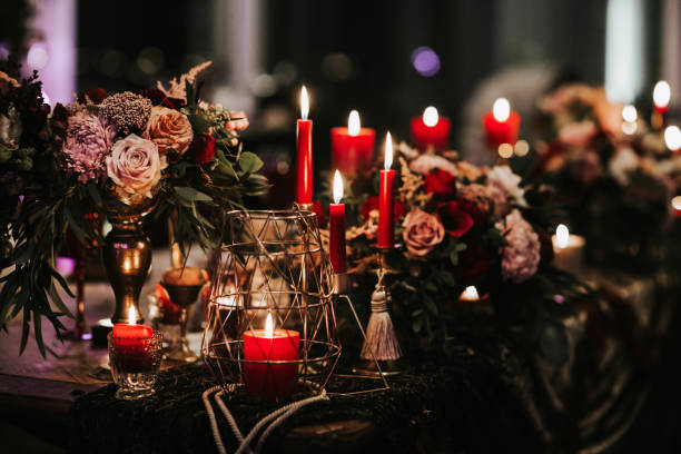 istock Beautiful, decorated table with flower decorations and red candles. Christmas evening or wedding party decoration. 1188617821