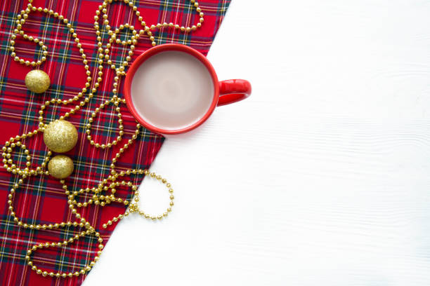 istock A cup of hot cocoa in red cup on white table. Copy space. 1188617828