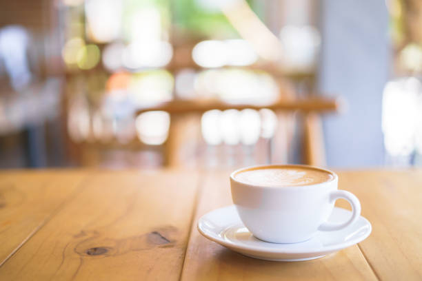 istock Cup of coffee with fern tree pattern milk foam 1188617866