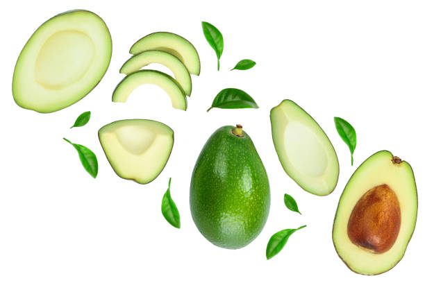 istock avocado and slices decorated with green leaves isolated on white background with copy space for your text. Top view. Flat lay 1188618042