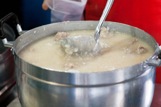 Cauldron with boiled rice and perk meat