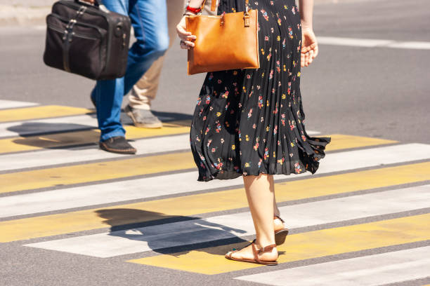 istock pedestrians crossing the street 1188620548