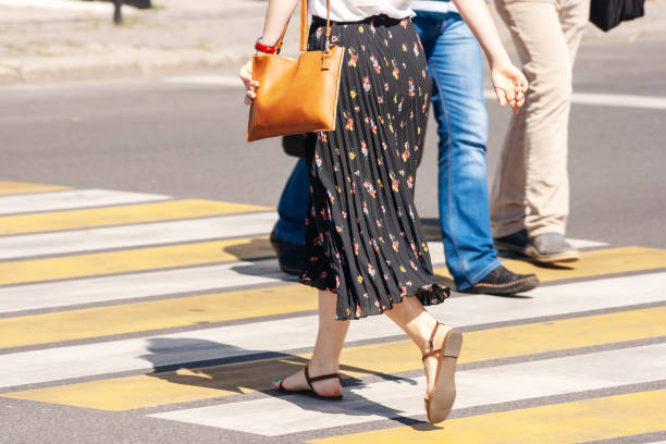 istock pedestrians crossing the street 1188620552