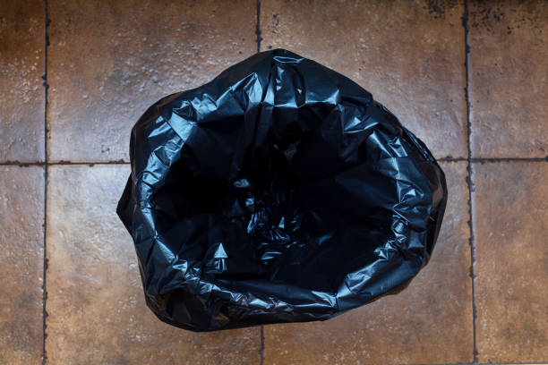 istock Empty black trash bag in a bucket on the kitchen floor 1188621153