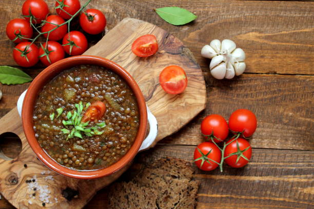 istock Delicious lentils soup on wooden background. 1188621967