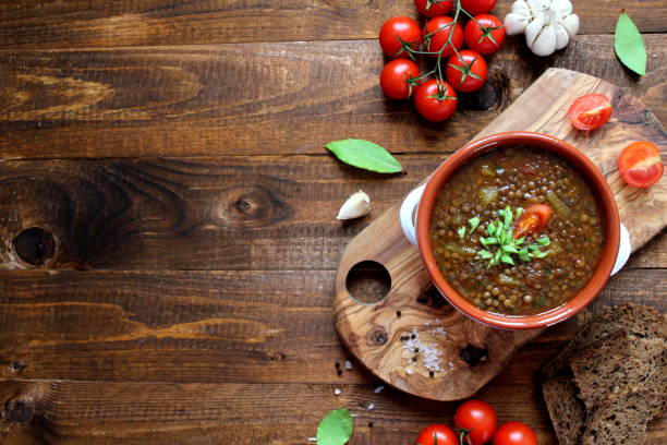 istock Delicious lentils soup on wooden background. 1188621969