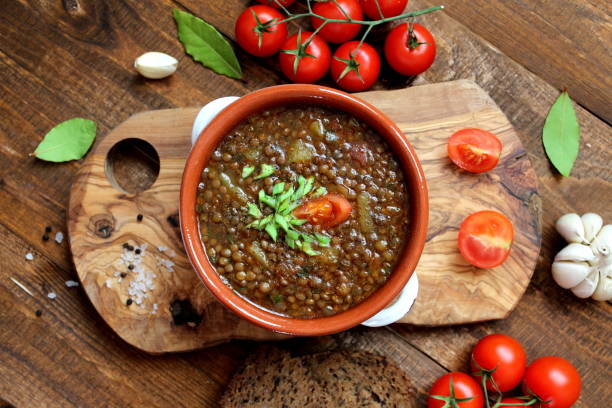 istock Delicious lentils soup on wooden background. 1188621984