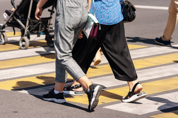 istock pedestrians crossing the street 1188622012
