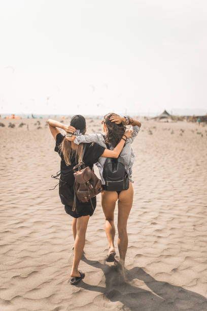 istock Happy two friends on the beach 1188622063