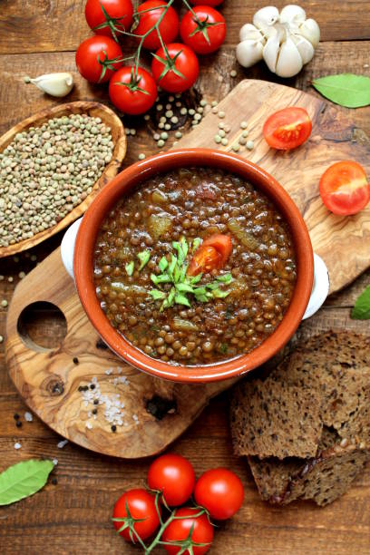 istock Delicious lentils soup on wooden background. 1188622122