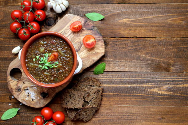 istock Delicious lentils soup on wooden background. 1188622178