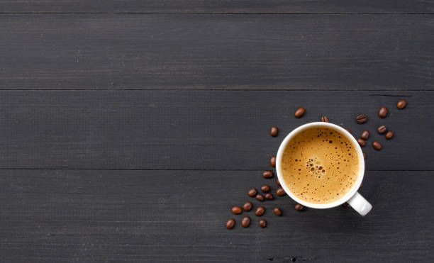 istock hot coffee and bean on wooden background. top view 1188622223