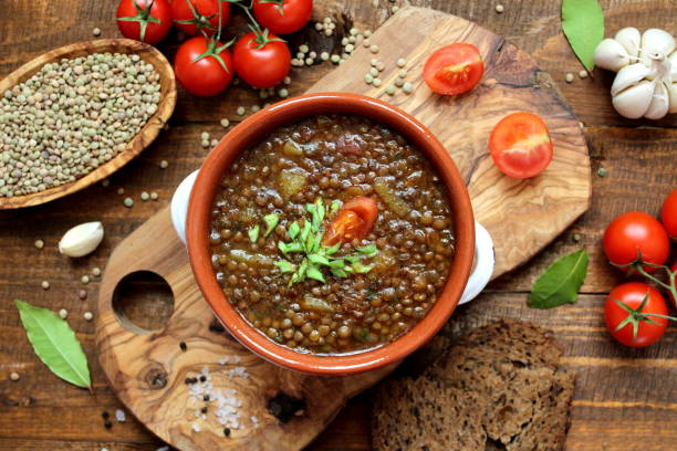 istock Delicious lentils soup on wooden background. 1188622267