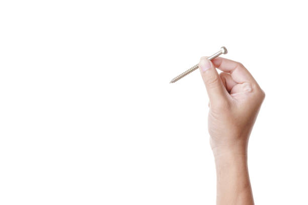 istock Hand holding steel screw 1188623648