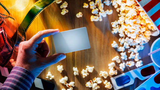 cinema ticket - glasses holding business card imagens e fotografias de stock