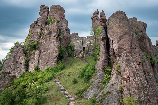 Beautiful landscape with bizarre rock formations. Stone stairs leading to the amazing rock formations and walls of a medieval fortress in Belogradchik, northwest Bulgaria.