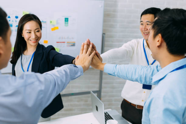 istock Business people showing unity and collaboration gesture 1188624018
