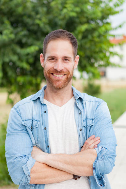 istock Casual guy relaxed in a park 1188624944