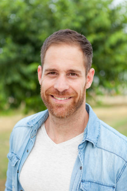 istock Casual guy relaxed in a park 1188624947