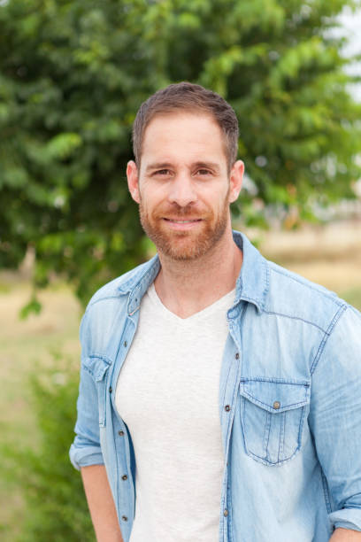 istock Casual guy relaxed in a park 1188624950