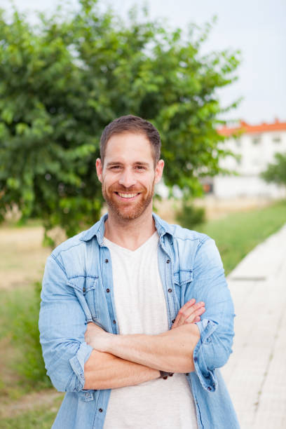 istock Casual guy relaxed in a park 1188624961