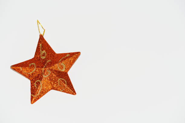 istock Orange Christmas star isolated on white background 1188625230
