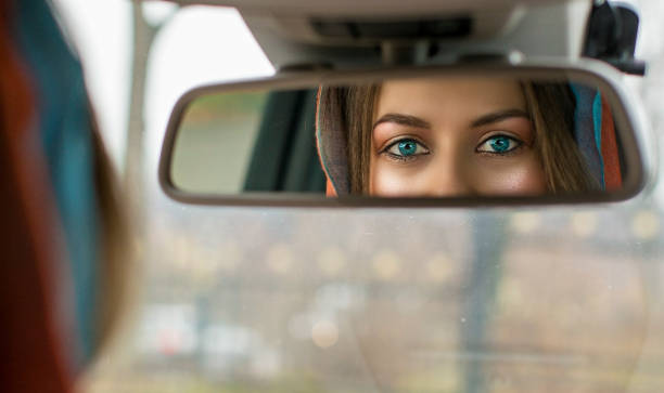 2,500+ Woman Rear View Mirror Stock Photos, Pictures & Royalty-Free ...
