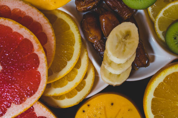 istock Tropical fruits and extra dried dates on wooden table 1188625369