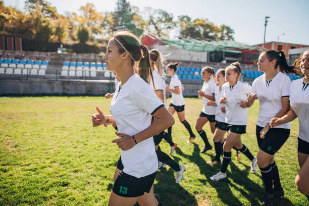 istock Women soccer team jogging together 1188626813