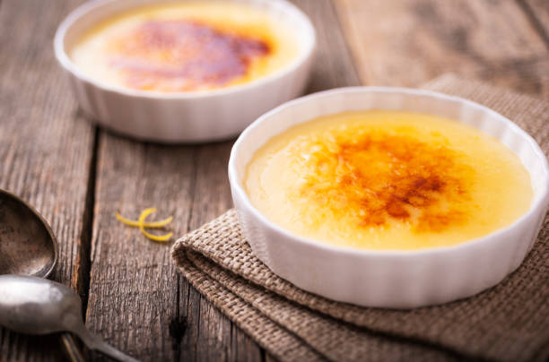 istock Catalan cream with spoons on old, wood table 1188626897
