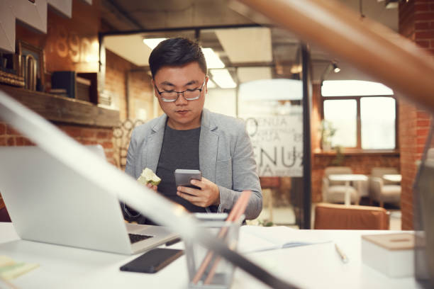 istock Contemporary Asian Businessman at Workplace 1188627578