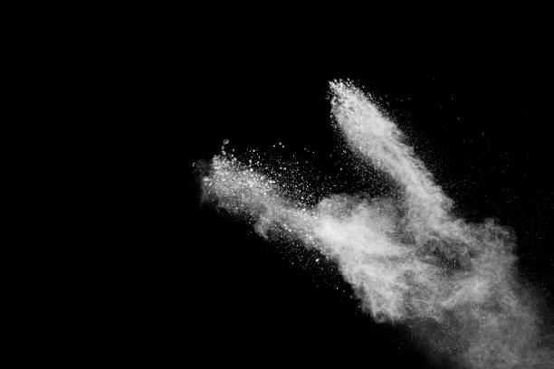 istock Bizarre forms of of white powder explosion cloud against dark background.Launched white dust splash on black background. 1188628268